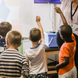 Children in a classroom participating