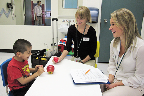 two researchers in clinical setting