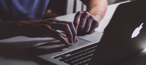 Person typing on a laptop