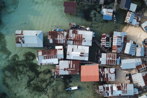 houses and buildings on the shoreline in the Caribbean