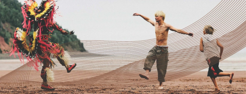 Portion of the "Wildhood" movie poster featuring three men playing on a beach