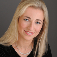 headshot of Vardit Ravitsky: blond woman wearing a black sweater and silver necklace