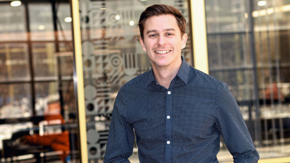 Josh Swain - young man with short brown hair wearing a blue button-down shirt