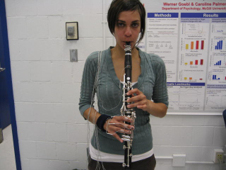 A woman plays clarinet