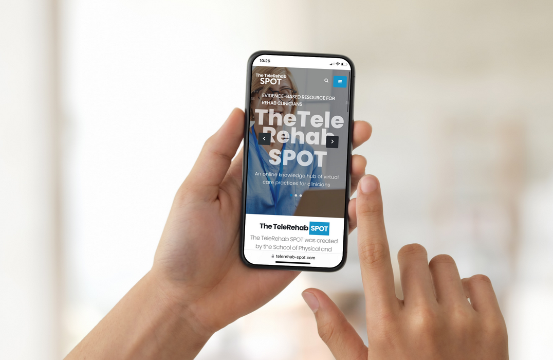 Picture of two hands holding an iphone with the Telerehab SPOT website open 