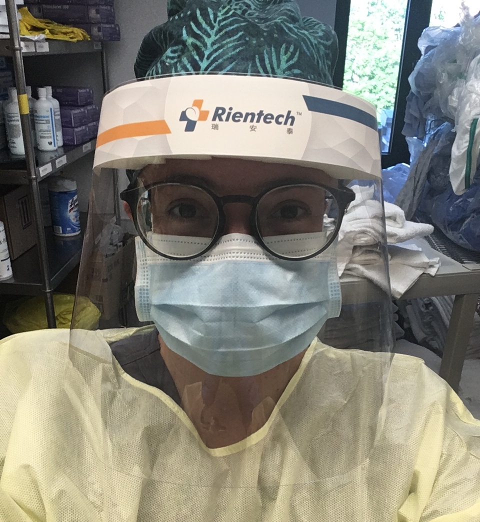 Rachel Prudhomme in personal protective equipment (mask and visor) while at work in a CHSLD