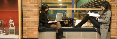 two female students studying in an alcove