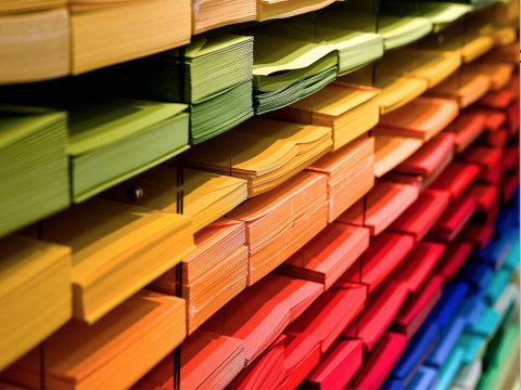 rainbow-coloured stacks of papers