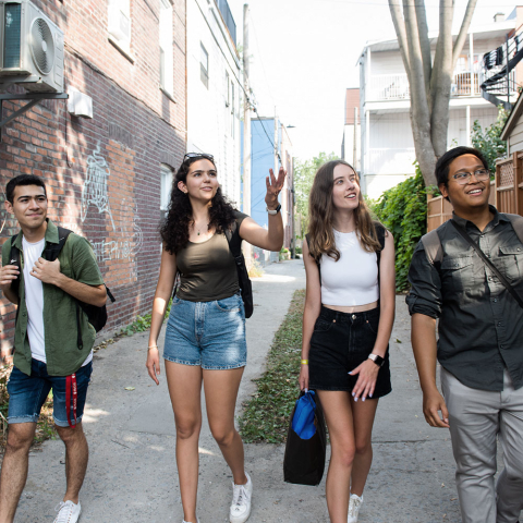 4 students walking through a classic Montreal neighbourhood
