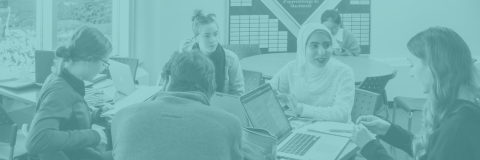 Students gather around a table covered in books and laptops with a light blue gradient overlaid.