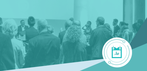 A crowd gathered, watching a man speak at a podium, with a Sustainable Events logo in the lower right corner.