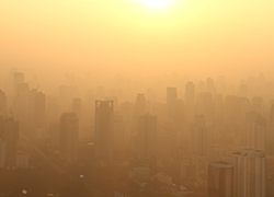 Smog on a cityscape at sunset