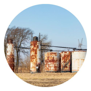 Abandoned oil wells with a blue sky