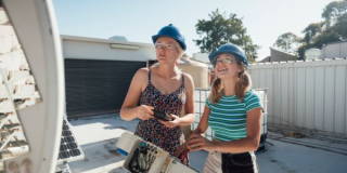 two female engineering students working with switches on energy