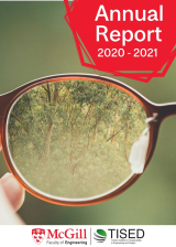 close up of a lens of glasses and through the lens you see trees green background and red marker that reads Annual Report 2020-2021 with mcgill and tised logo