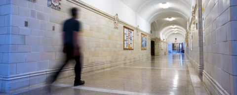 Person walks down a hall