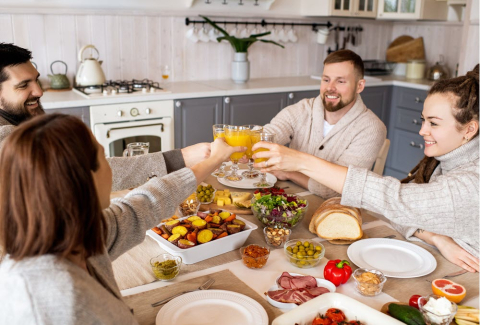 Four people around a dinner table 