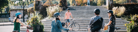 Students on bikes discussing