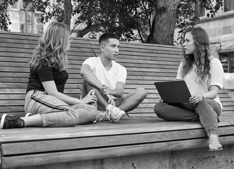 McGill students chatting on downtown campus bench
