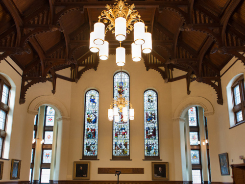 View of Redpath Hall: Ceiling, light fixtures and stained glass windows.