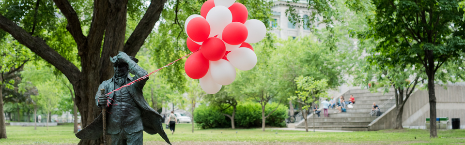 Bouquet of red and white balloons tied to James McGill statue
