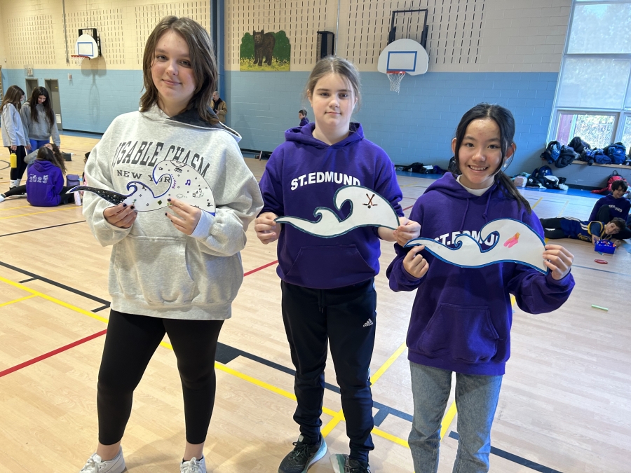 Students holding their waves