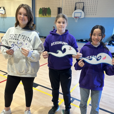 Students holding their waves