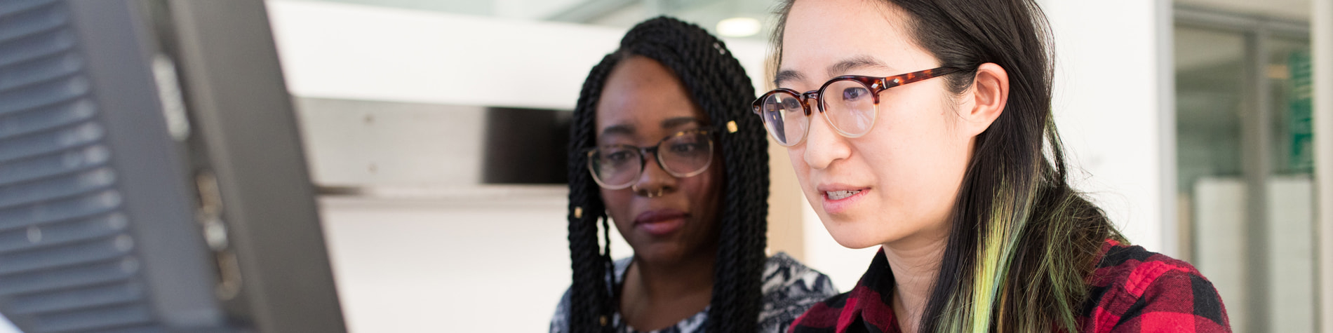Two women in front of a computer