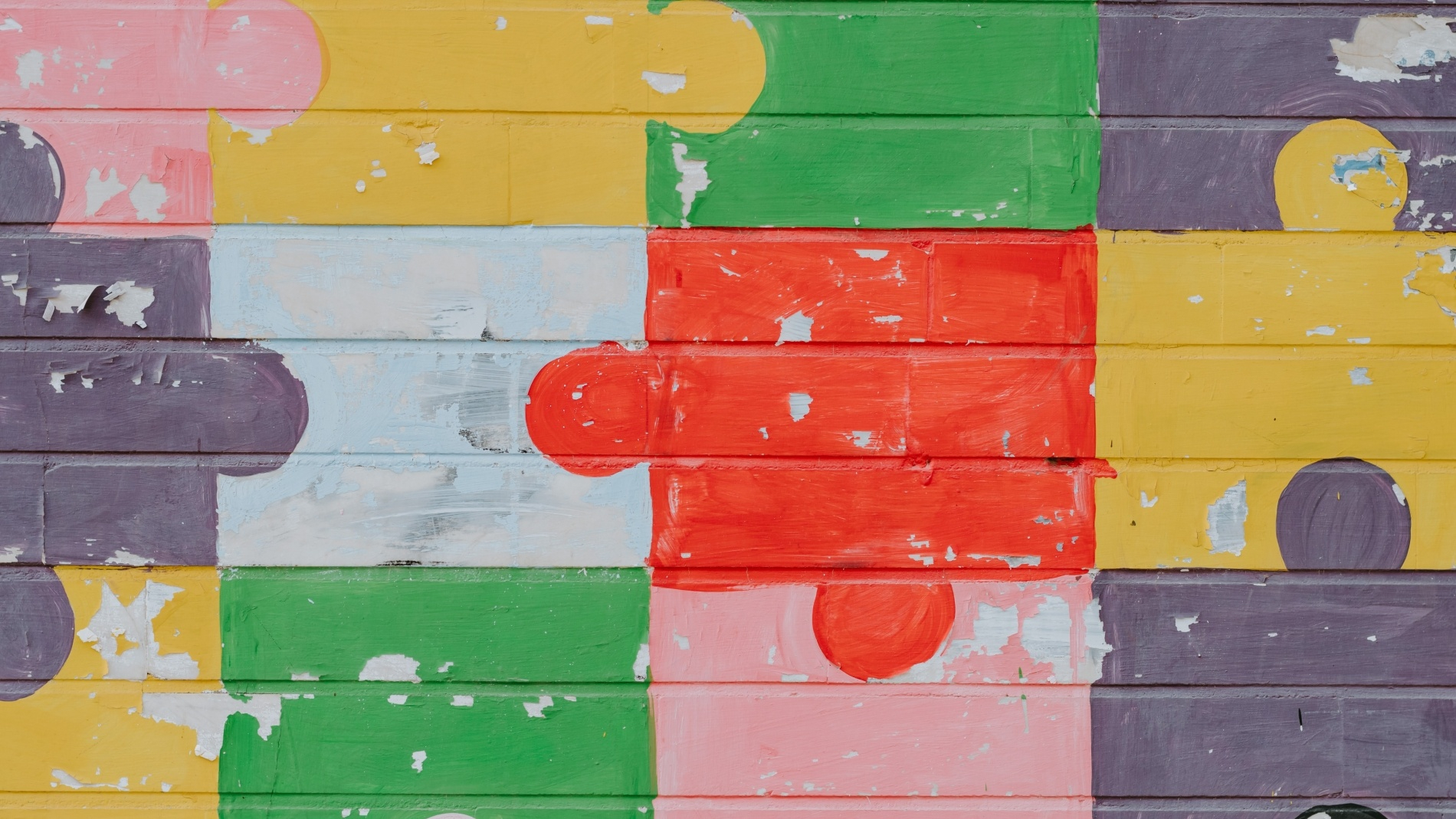 Wall painted with colourful puzzle pieces