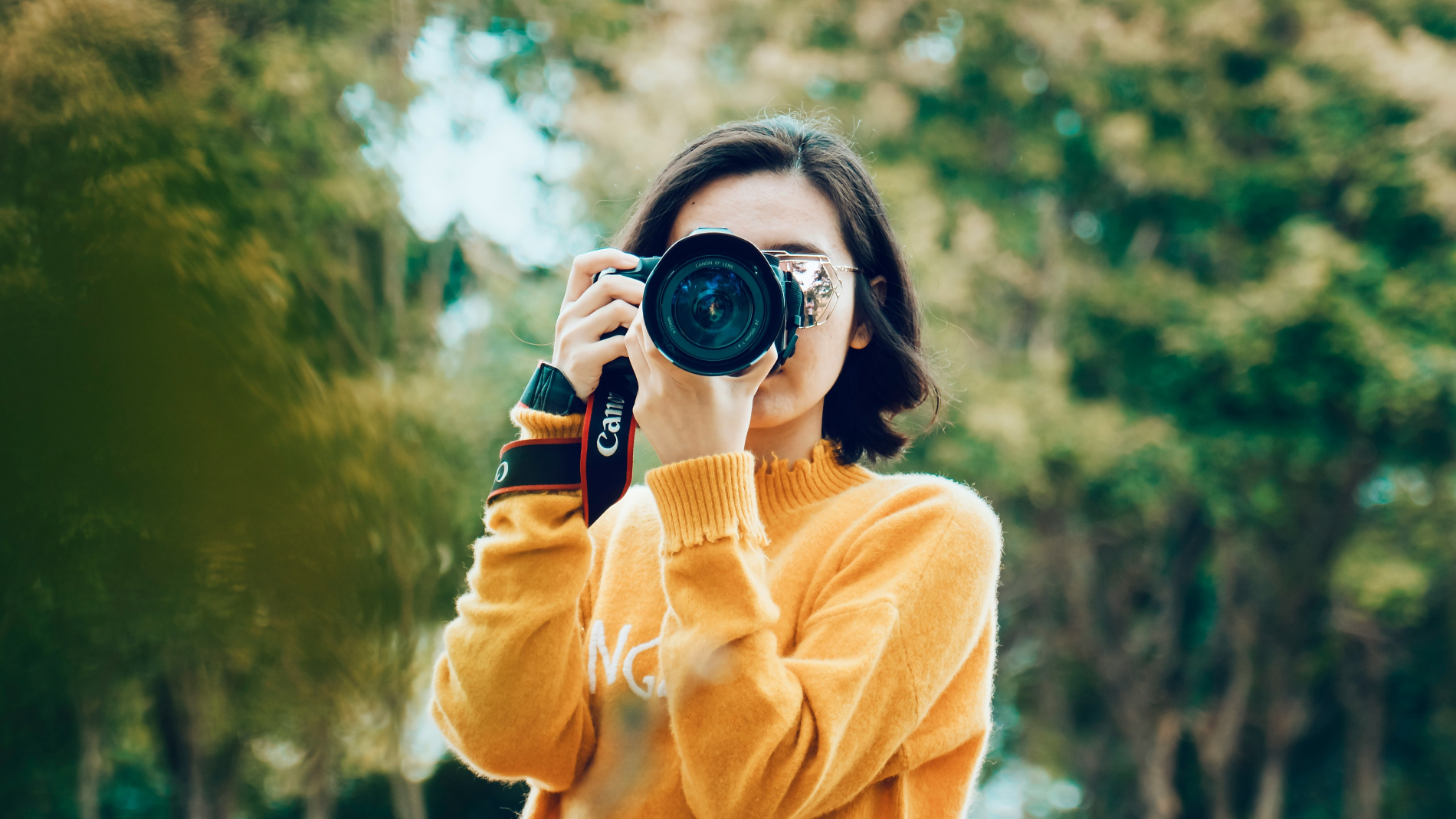 Woman holding dslr camera