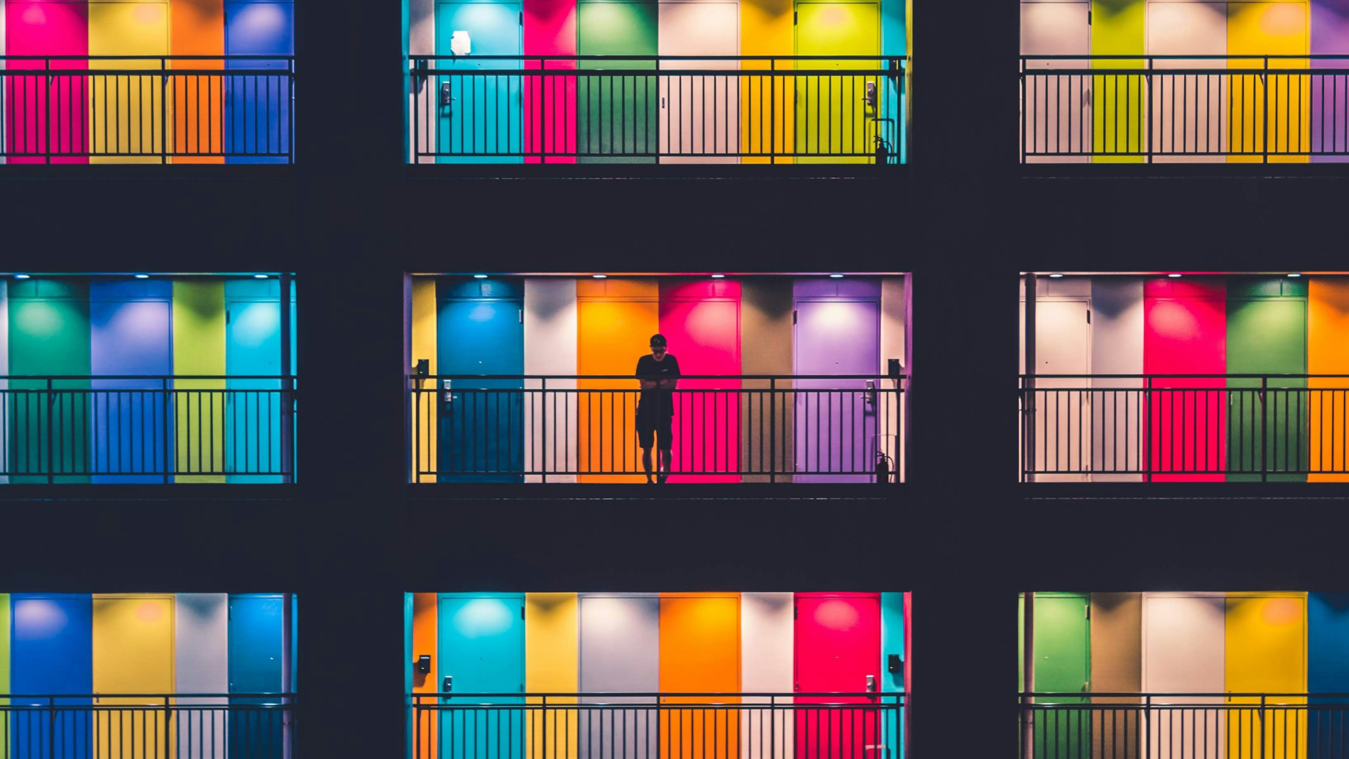 Abstract colourful side view of residential building with multicoloured balconies