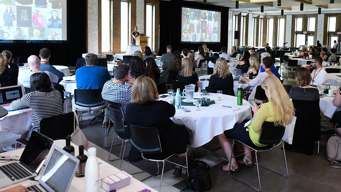 Audience watching a speaker present at #PSEWeb 2019 at the University of Saskatchewan.