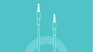 Two white audio jacks on a turquoise background