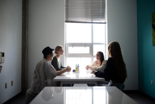 Students talking in the flex space