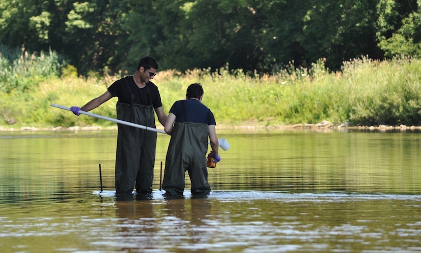 Two People Drudging Water 